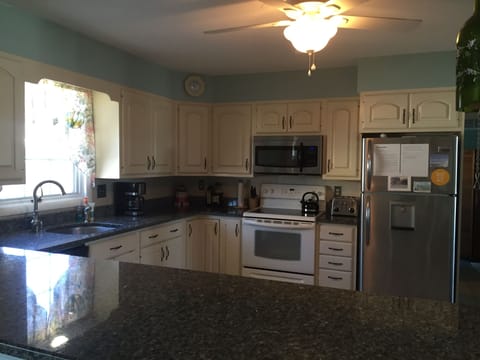 Kitchen with granite countertops.  