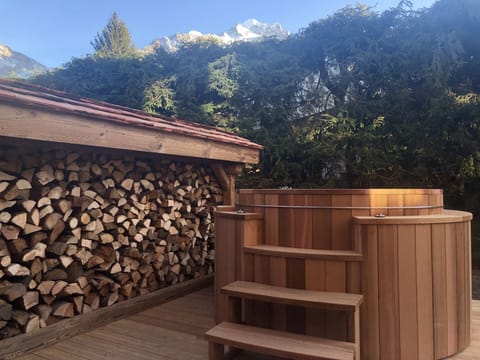 Handcrafted wooden hot tub to be enjoyed in winter and summer alike