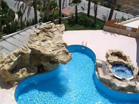Pool View from Balcony - Waterfall and Jacuzzi