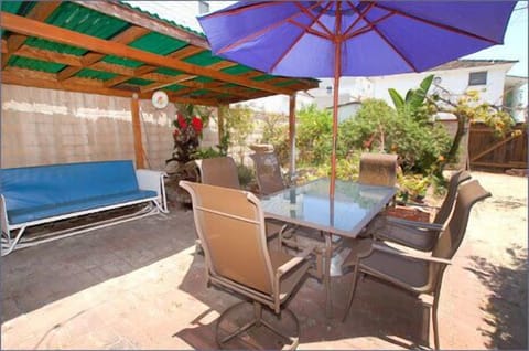 Private backyard patio dining, garden, and BBQ and even a sandlot for the kids!