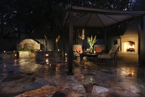 Relax or BBQ next to the Outdoor Fireplace, Fountain, & mini Bocce Ball court