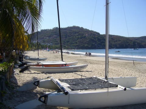 On the beach, sun loungers, beach towels