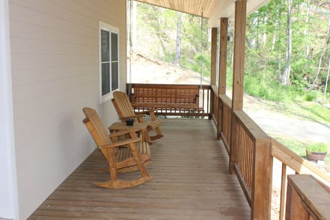 Front Covered Porch with Rocking Chairs and Porch Swing