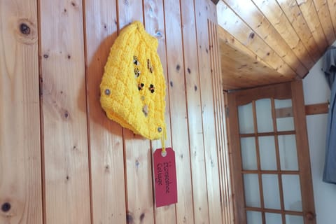 Special Tea Cosy with Bee motifs, made for Horseshoe by Sue, a cottage guest!