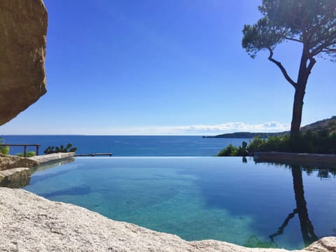 Our infinity pool, carved off the granite stone, has a stunning view of the bay.