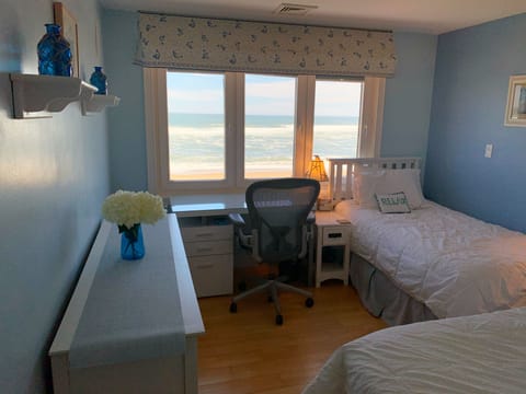 Enjoy ocean views from the 2nd floor middle bedroom with twin beds and a desk