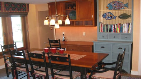 Enjoy the large kitchen table & desk area leading to a newly renovated 1/2 bath