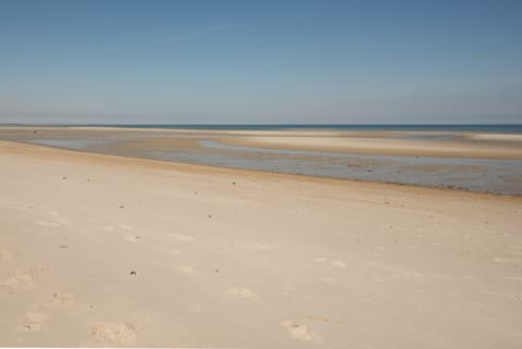 On the beach, sun loungers, beach towels