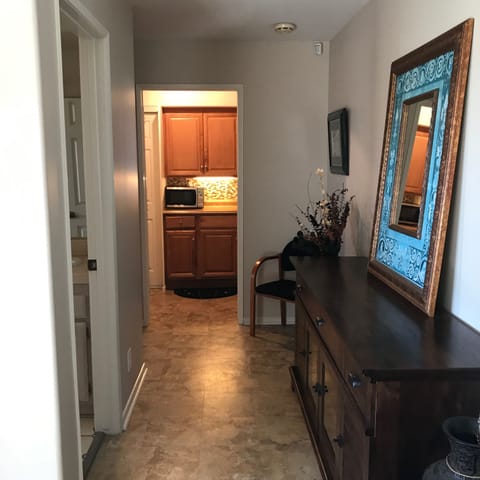 HALL FROM LIVING ROOM TO BATH, KITCHEN,AND BEDROOM