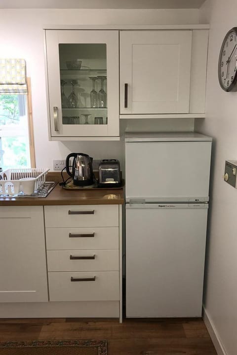 Fridge/freezer and glass display cabinet.