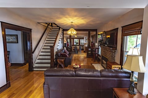 Living room features beautiful woodwork, comfy seating - overlooks Stone Lake.