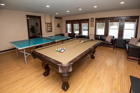 Gathering-Game Rm has 4 leather sofas,Bistro tables.PingPong top for Pool Table.