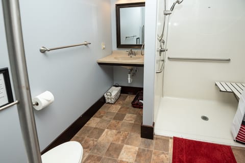 Accessible AGW main floor BR-BA suite is barrier-free w/ roll-in 3x5 shower.