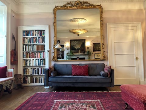 Living room with 2 bureaus to work, SMART TV, Netflix, DVDs & books library.