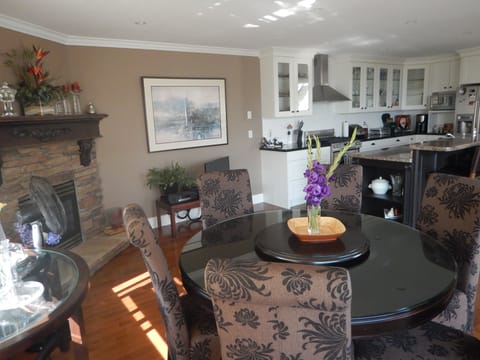 Dining area in great room with view over beach & ocean. 