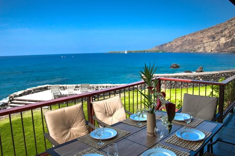 Breathtaking View from Lanai of Kealakekua Bay featuring covered outdoor dining.
