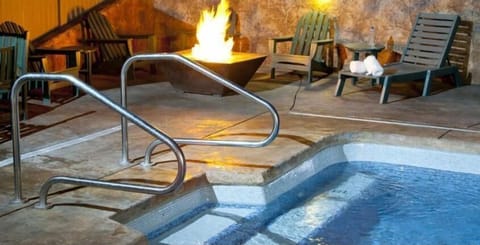 heated outdoor pool with fire pit