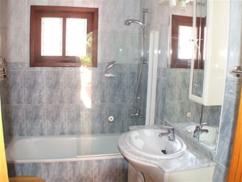 Bathroom with bath and shower