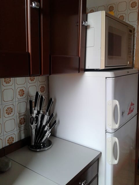 Fridge, microwave, cookware/dishes/utensils