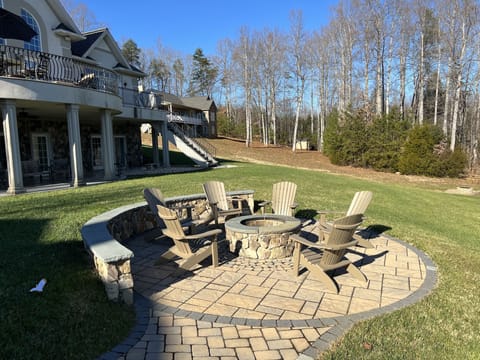 Outdoor fire pit with ample seating.