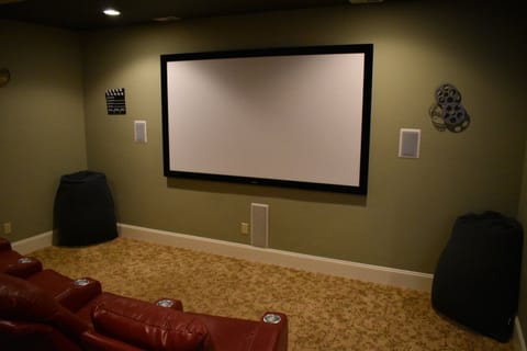 Media room has a 9 foot screen. Great for watching movies and sports.