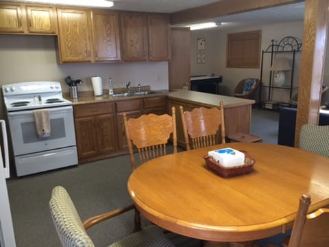 Kitchen/Dining room.  Oak cabinets.  Electric stove, microwave.