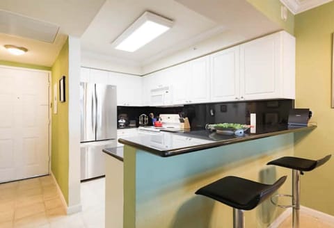 Black Marble Breakfast Counter w 2 Banquets. New 3 doors LG French Style Fridge.