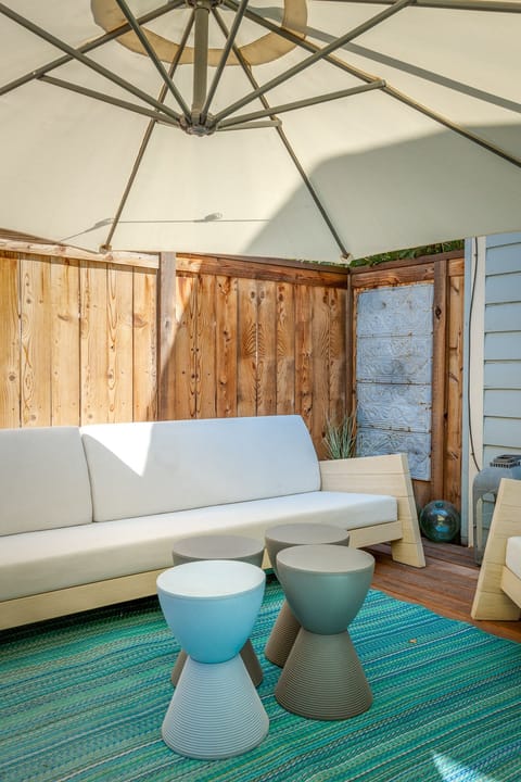 Back patio with enormous 13 foot sofa.