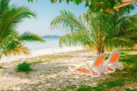 On the beach, sun loungers, beach towels