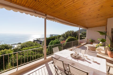 A dining table where meals can be taken overlooks the sea