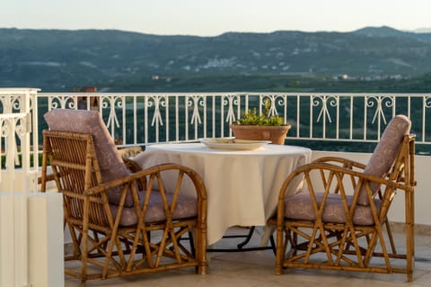 TAKE YOUR BREAKFAST AT THE FRONT VERANDA IN THE MORNING OVERLOOKING THE VILLAGES