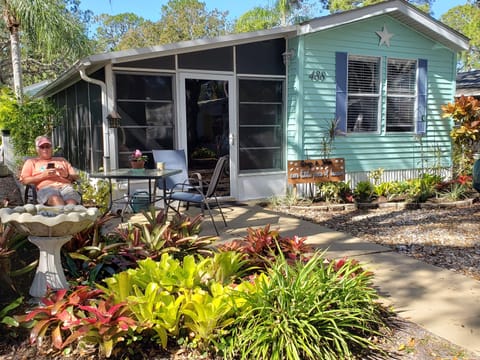 Located on charming Osprey Loop w bromeliad garden, patio, parking for 2.