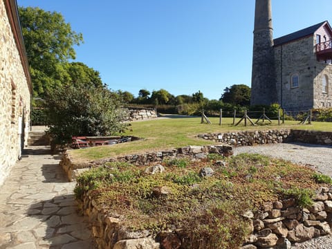 Garden of Cottages. Cottages on left. (Engine House not for holiday rental)