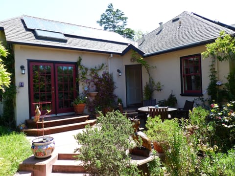 Back of house. French doors lead to master BR.