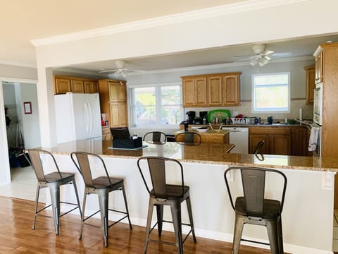 Center dining island provides indoor seating for 8.