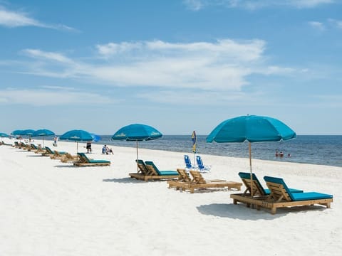 On the beach, sun loungers, beach towels