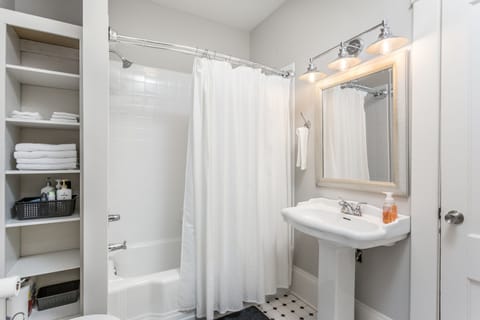 Combined shower/tub, hair dryer, towels, soap