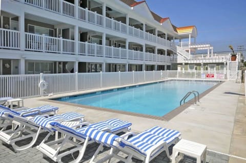Poolside walk out from unit directly to fenced in pool - includes kiddie pool