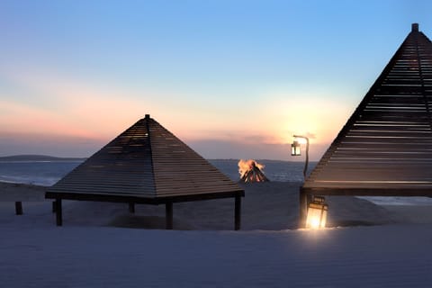 On the beach, sun loungers, beach towels