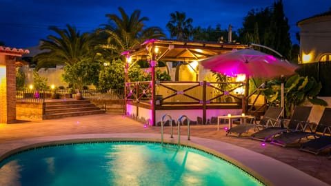 Outdoor pool, a heated pool, sun loungers