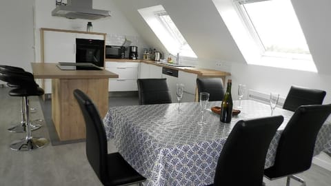 Dining area (6 persons) and kitchen area.