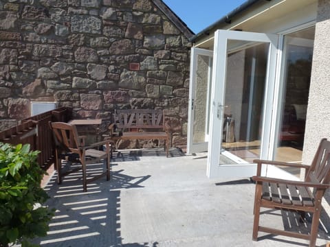 French doors leading onto the shared enclosed patio area