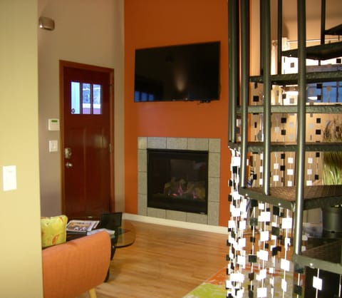 Living Room with cozy gas fireplace and 55" flatscreen TV