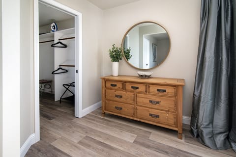 Make yourself at home with this luxurious walk-in closet and dresser in master