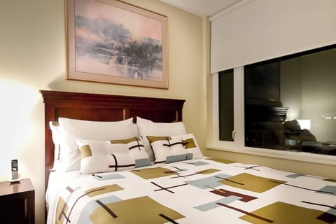 Queen bed in bedroom #2 including upgraded black-out blinds for a restful sleep.