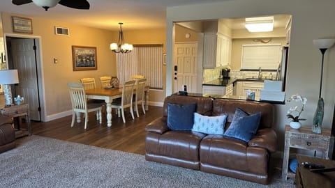 Second powered recliner sofa with kitchen and dining in background