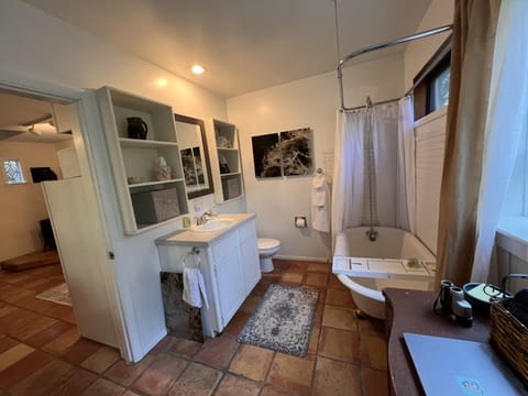 Combined shower/tub, hair dryer, towels, soap