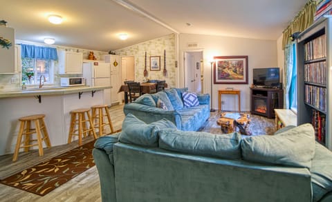 Living room - vinyl flooring, couch & loveseat, TV, coffee table and much more