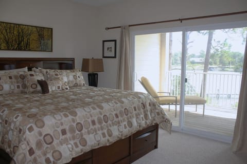 Master bedroom with water view-Typical 2 BR-All units are furnished similarly