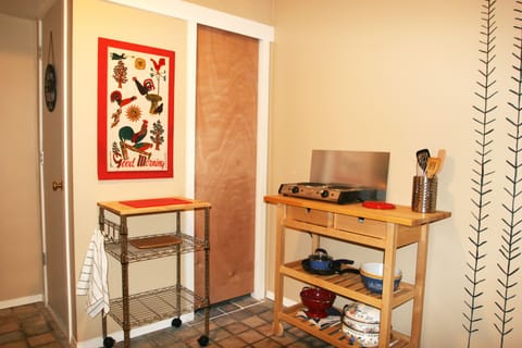 Kitchenette with a two-burner stove top and convenient prep areas
